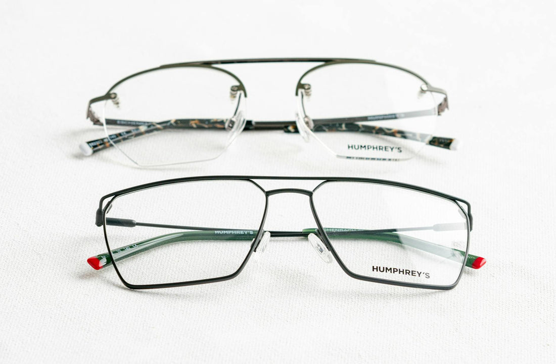 Sophisticated eyeglasses on a smooth white surface, showcasing stylish design.