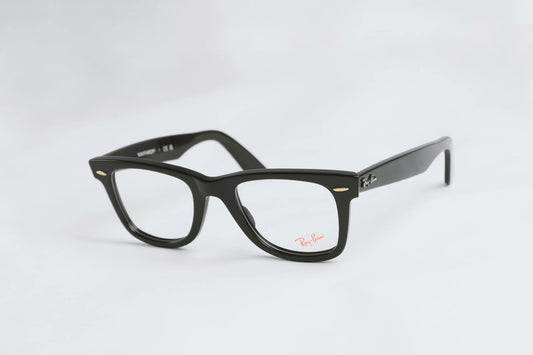 Classic black eyeglasses with Ray-Ban branding on a white backdrop, highlighting their sleek design.