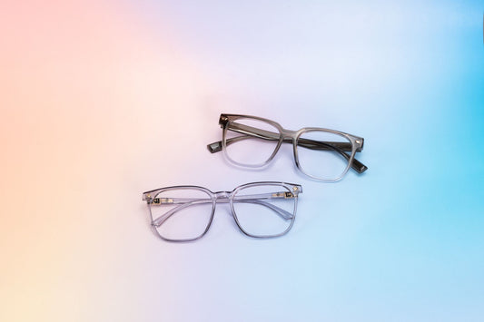 Two stylish pairs of eyeglasses on a gradient pastel background, highlighting eyewear design.