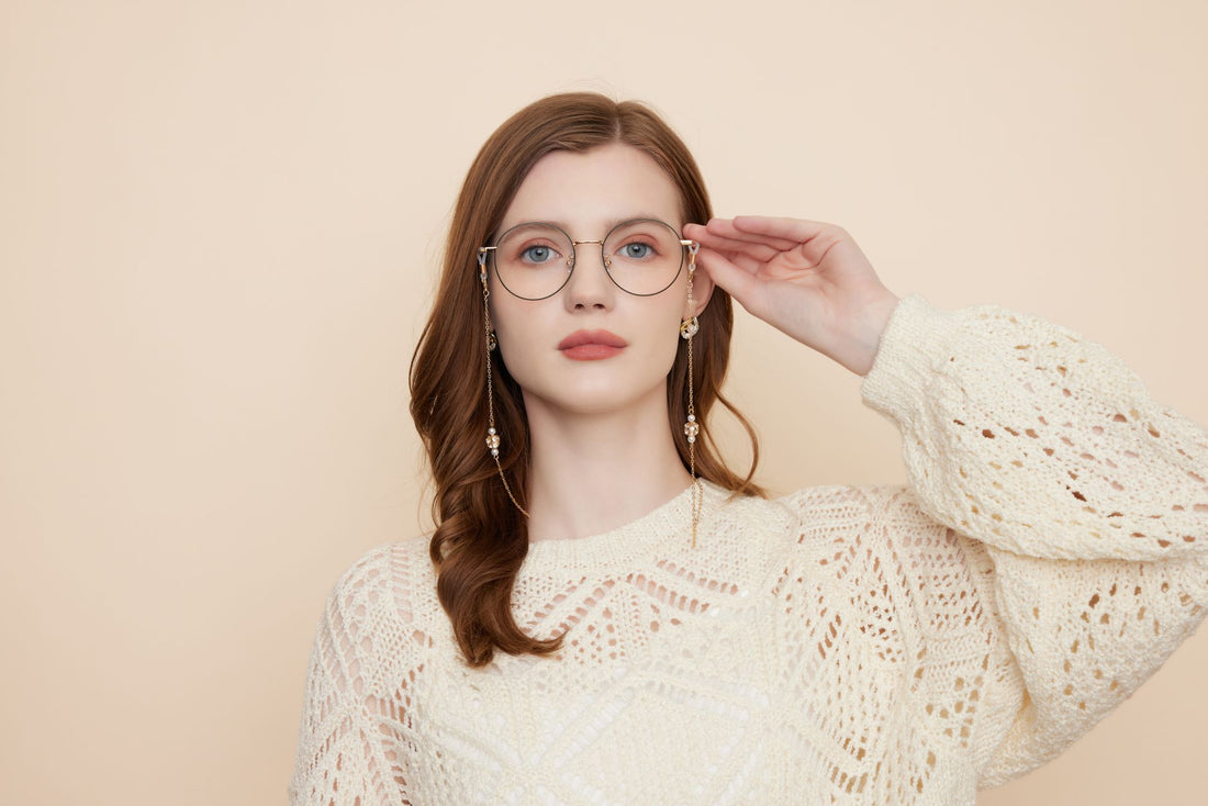 Portrait of a woman in glasses with beige background, embracing fashion style.