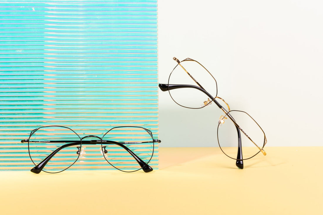 Two pairs of stylish glasses on a vibrant minimalist background, showcasing modern fashion eyewear.