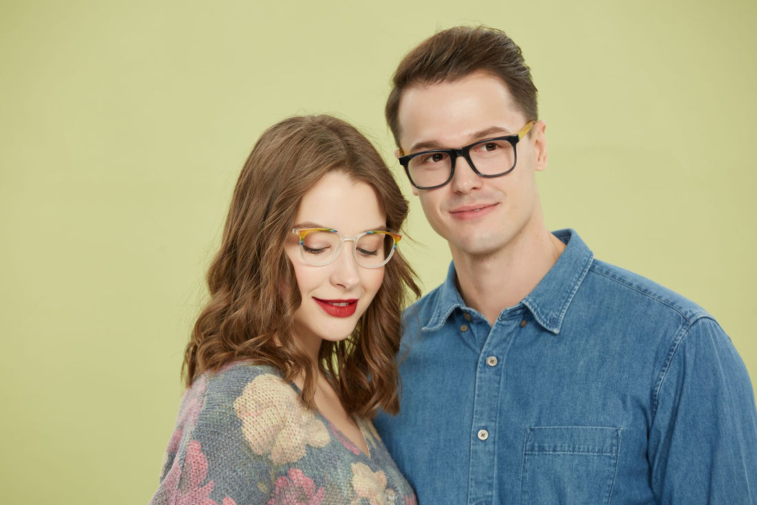 Chic couple posing with trendy eyeglasses against a pastel backdrop, showcasing fashion and style.